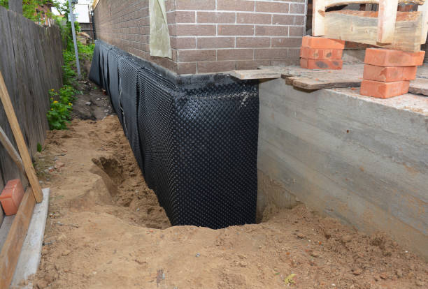 SJ Waterproofing Pros technician performing targeted Exterior Waterproofing assessment in Washington, MI
